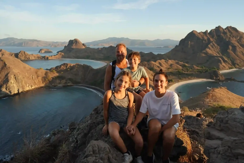 A family at the Padar Island viewpoint above its three bays