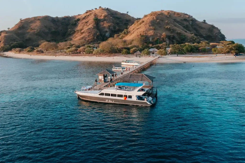 The jetty at Kanawa Island with a boat moored alongside
