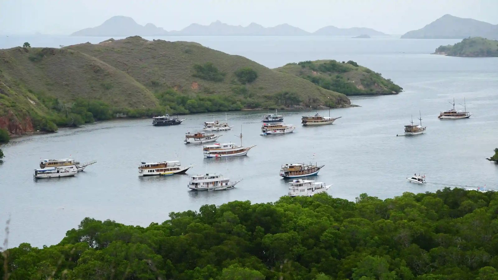 A phinisi sailing between the islands of eastern Indonesia