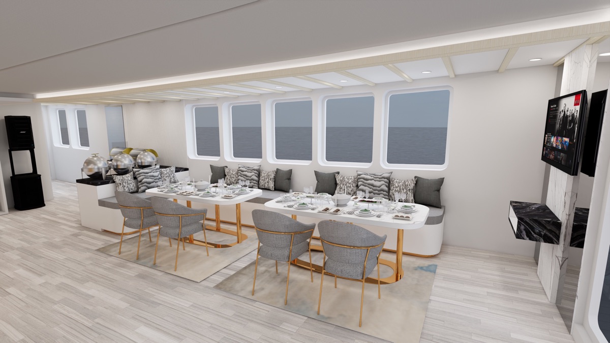 Private indoor dining room aboard LASHA set for a full charter group