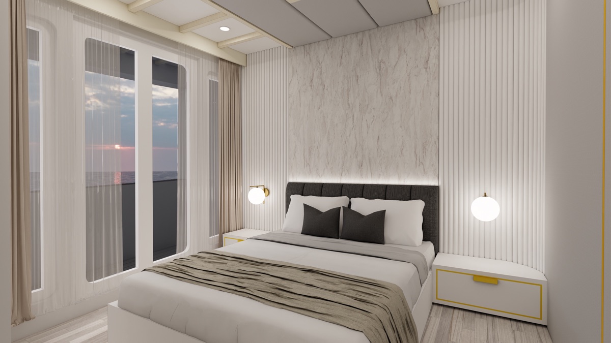 Private balcony of a LASHA Junior Suite with a double bed facing open Indonesian sea