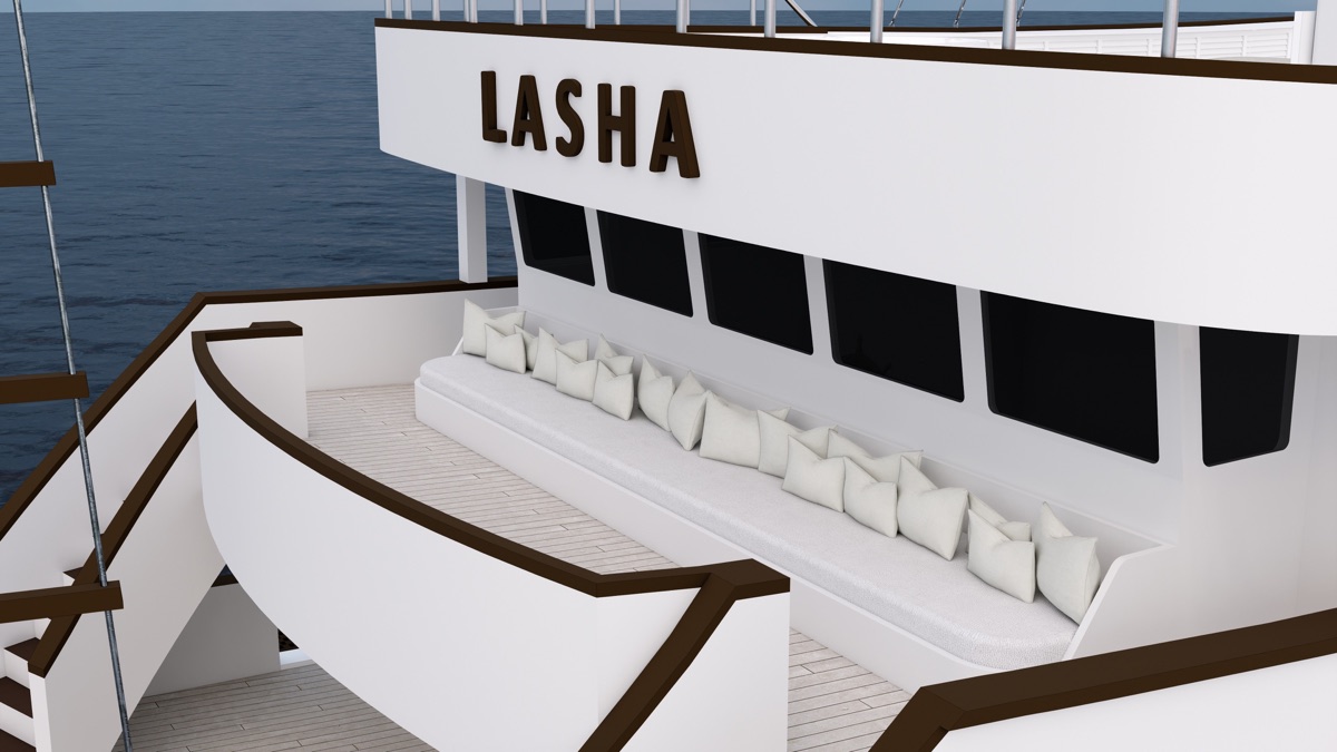 Stern lounge seating on LASHA facing the water at anchor near Pink Beach